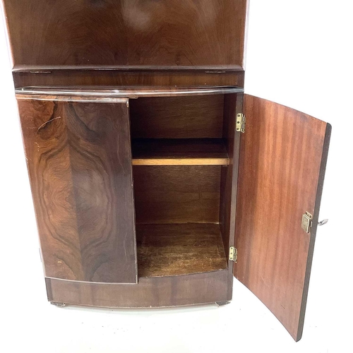 1888 - A Rivington walnut veneer cocktail cabinet with mirrored interior retaining the original lemon squee... 