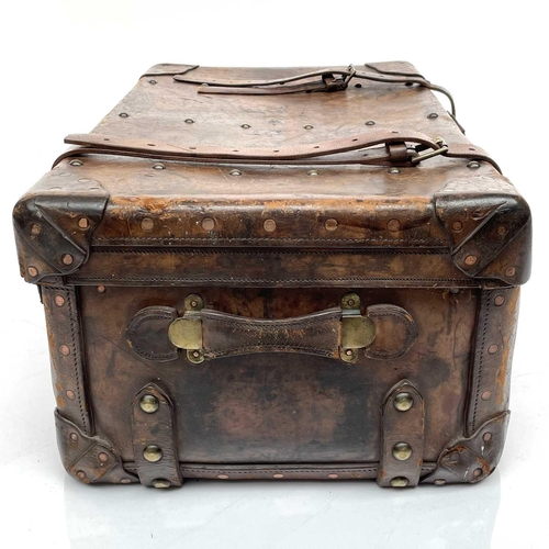 1890 - An early 20th century leather luggage case stencilled C.St J C, height 34cm width 80cm depth 50cm.