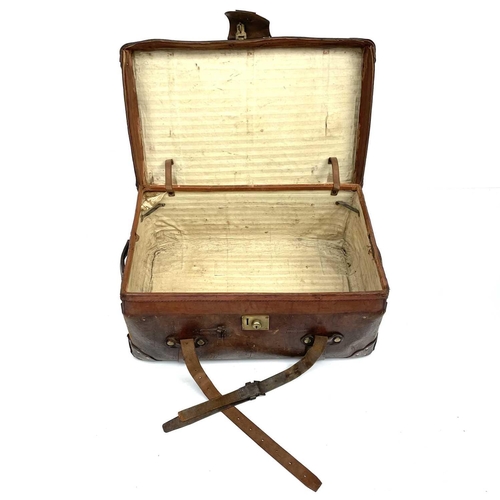 1890 - An early 20th century leather luggage case stencilled C.St J C, height 34cm width 80cm depth 50cm.