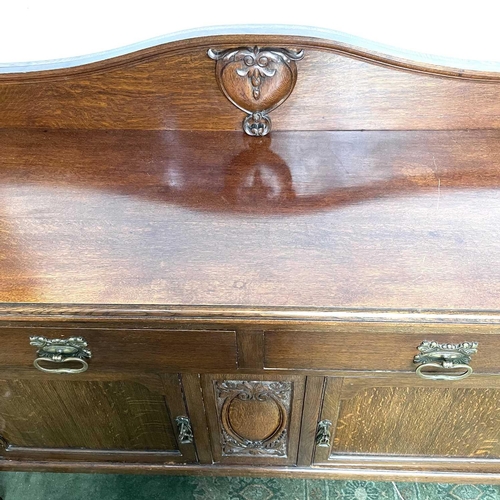 1893 - An Edwardian oak sideboard, fitted twp drawers and two doors on carved cabriole legs, height 124cm, ... 