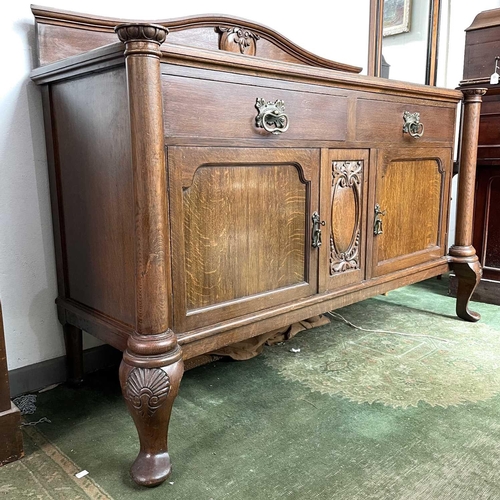 1893 - An Edwardian oak sideboard, fitted twp drawers and two doors on carved cabriole legs, height 124cm, ... 