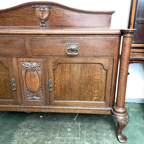 1893 - An Edwardian oak sideboard, fitted twp drawers and two doors on carved cabriole legs, height 124cm, ... 