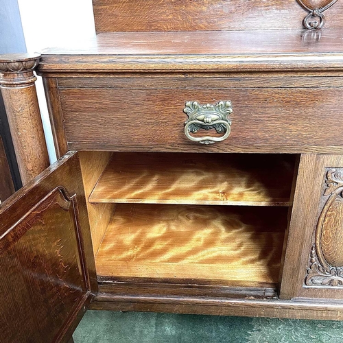 1893 - An Edwardian oak sideboard, fitted twp drawers and two doors on carved cabriole legs, height 124cm, ... 