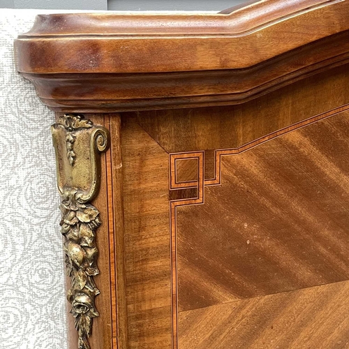 1897 - A French walnut, inlaid and metal mounted bedstead, circa 1920, the footboard with vase inlay, heigh... 