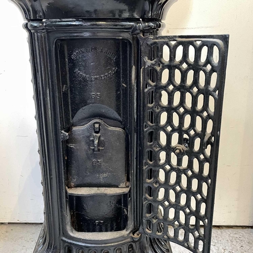 1900 - A French Bodin & Cie cast iron stove, circa 1920, height 87cm.