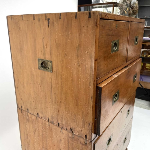 1902 - An early Victorian teak two-part campaign chest, with two short and three long drawers with recessed... 