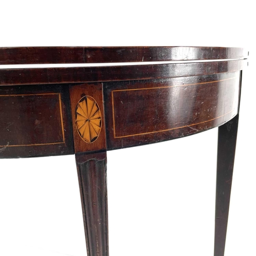 1903 - A George III mahogany half round fold top tea table, with segment panels and kingwood inlay, on squa... 