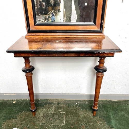 1911 - A figured walnut console table with a matched pier mirror, late 19th century, with ebonised decorati... 