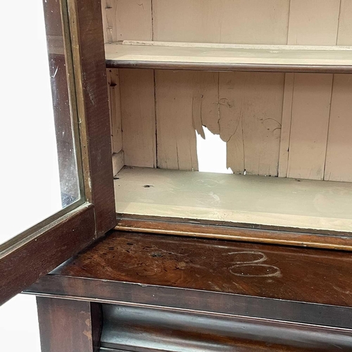 1916 - A Victorian mahogany bookcase cabinet, the upper part with moulded cornice above two glazed doors, t... 