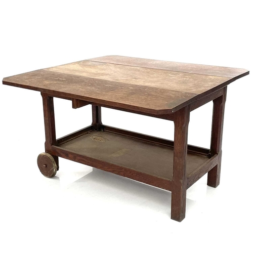 1918 - An Arts and Crafts oak low trolley, with two leaves on chamfered square legs and an undertier, heigh... 