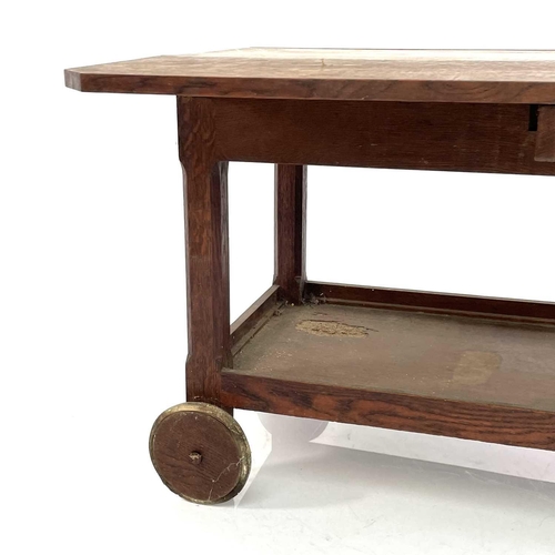 1918 - An Arts and Crafts oak low trolley, with two leaves on chamfered square legs and an undertier, heigh... 