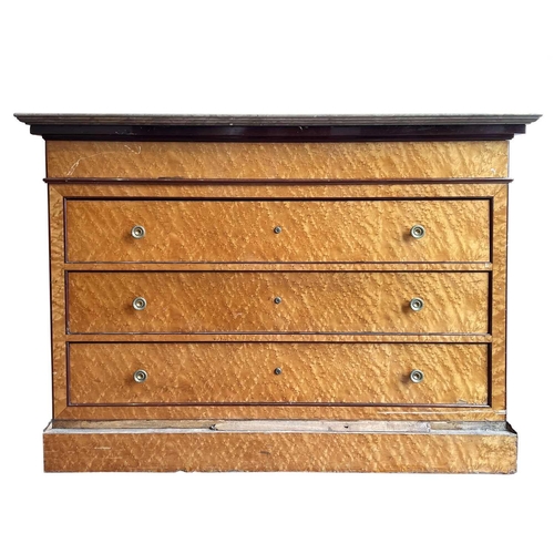 1922 - A Biedermeier maple chest, with a gray marble top above four long drawers and raised on a plinth bas... 