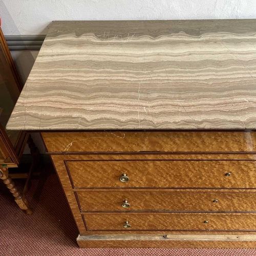 1922 - A Biedermeier maple chest, with a gray marble top above four long drawers and raised on a plinth bas... 