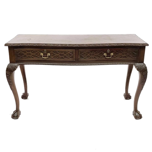 1925 - A Victorian style mahogany side table, with carved decoration, fitted two drawers and raised on carv... 