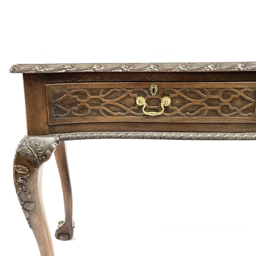 1925 - A Victorian style mahogany side table, with carved decoration, fitted two drawers and raised on carv... 