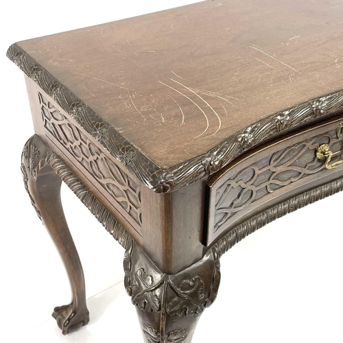 1925 - A Victorian style mahogany side table, with carved decoration, fitted two drawers and raised on carv... 