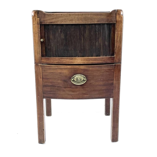 1929 - A George III mahogany night table, with a gallery top above a tambour front cupboard and pull-out dr... 