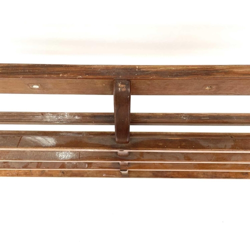 1934 - A teak open plate rack, 20th century, height 92cm, width 211cm, depth 13cm.