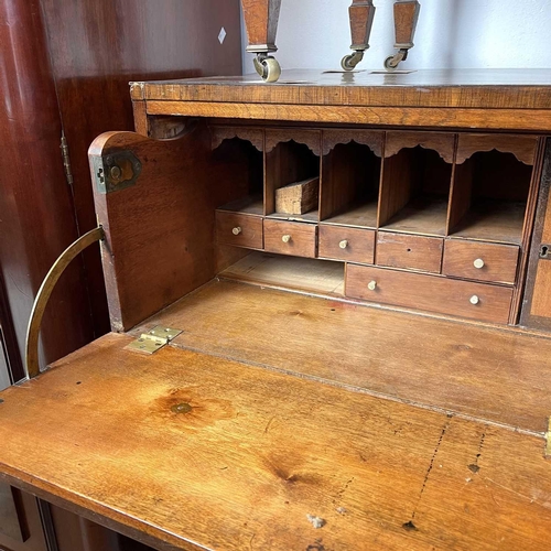 1935 - A George III mahogany secretaire chest. The large frieze drawer opening to reveal a fitted interior,... 