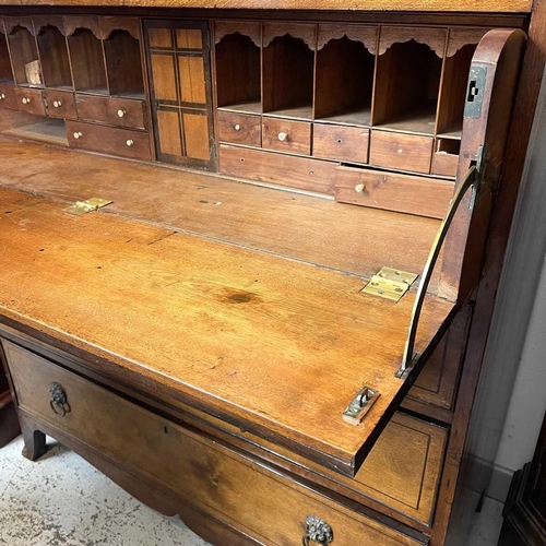 1935 - A George III mahogany secretaire chest. The large frieze drawer opening to reveal a fitted interior,... 