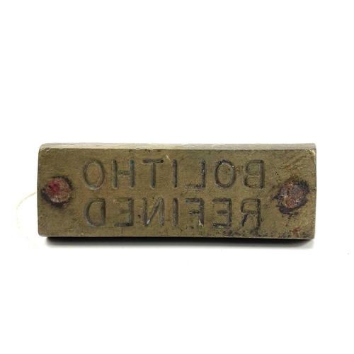 196 - A bronze hot mark inscribed 'BOLITHO REFINED', 11 x 4cm.