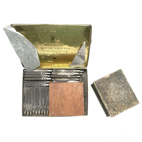 198 - A set of complete steel letter and number punches and a brass block.