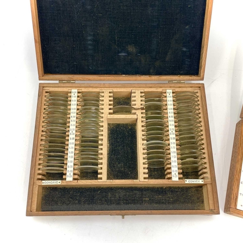 199 - A set of twelve Opticians lenses, with gilt metal fittings, contained in a glazed top oak case, widt... 