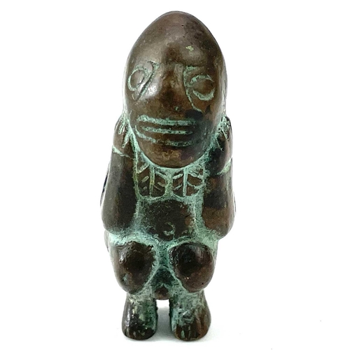 20 - Pre-Columbian bronze fertility figure modelled as a naked squatting male with his hands under his ch... 