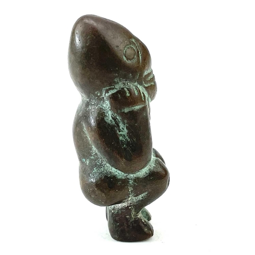 20 - Pre-Columbian bronze fertility figure modelled as a naked squatting male with his hands under his ch... 