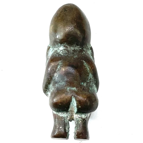 20 - Pre-Columbian bronze fertility figure modelled as a naked squatting male with his hands under his ch... 