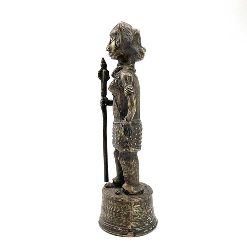 202 - A Benin style bronze figure of a warrior with a spear, height 31cm.