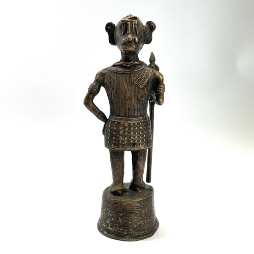 202 - A Benin style bronze figure of a warrior with a spear, height 31cm.