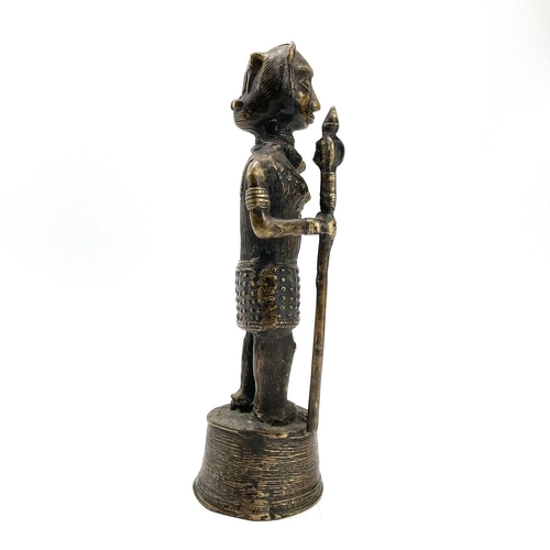 202 - A Benin style bronze figure of a warrior with a spear, height 31cm.