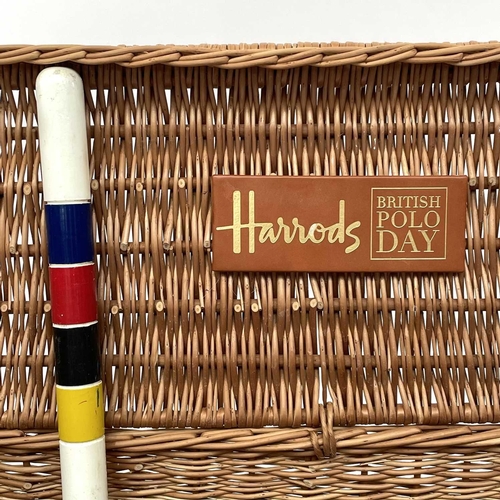 203 - A Harrods Polo Day part croquet set in a wicker basket.