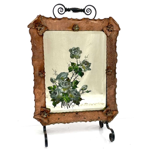 208 - A late Victorian mirrored firescreen, painted with roses and within an engraved copper frame with wr... 