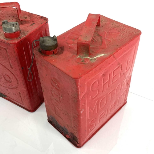 217 - Two vintage Shell petrol cans, an Esso example, and one other (4).