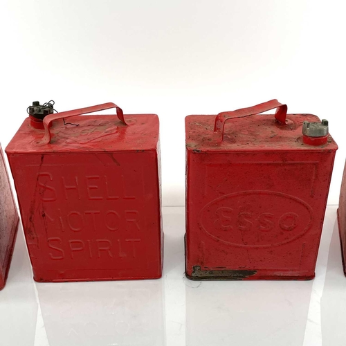 217 - Two vintage Shell petrol cans, an Esso example, and one other (4).