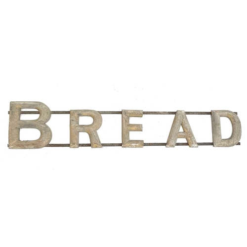 22 - .A vintage bread advertising sign, wrought iron and gilt wood, early-mid 20th century, length 183cm.