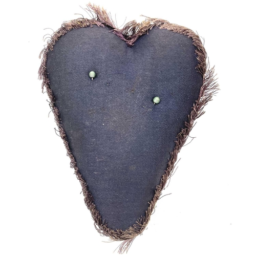 23 - An early 20th century soldier's sweetheart heart-shaped pin cushion, the black velvet covered obvers... 