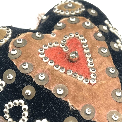 23 - An early 20th century soldier's sweetheart heart-shaped pin cushion, the black velvet covered obvers... 