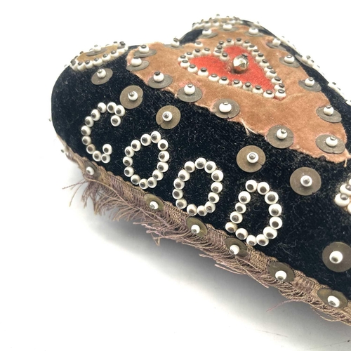 23 - An early 20th century soldier's sweetheart heart-shaped pin cushion, the black velvet covered obvers... 