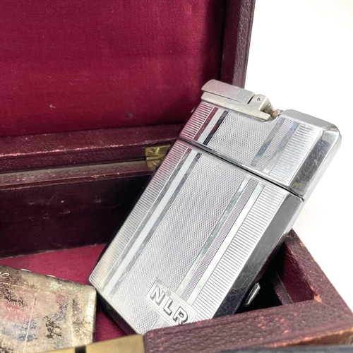 231 - A cigarette case with attached lighter monogrammed N L R together with a Swank arrow tie clip, Gille... 