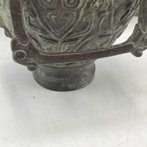 234 - An Archaic style cast metal water vessel and cover, with chain handle, height 21cm, together with a ... 