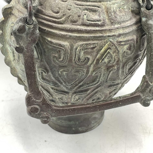 234 - An Archaic style cast metal water vessel and cover, with chain handle, height 21cm, together with a ... 