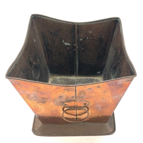 239 - An Arts and Crafts copper planter, of tapered square section, with twin handles, repousse decorated ... 