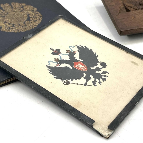 242 - An ash cigarette case with the Russian coat of arms, length 9cm together with a painted Russian coat... 