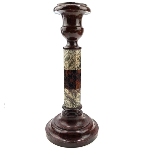 27 - A Cornish serpentine candlestick, raised on a banded octagonal column and turned base, height 28.5cm... 