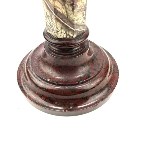 27 - A Cornish serpentine candlestick, raised on a banded octagonal column and turned base, height 28.5cm... 