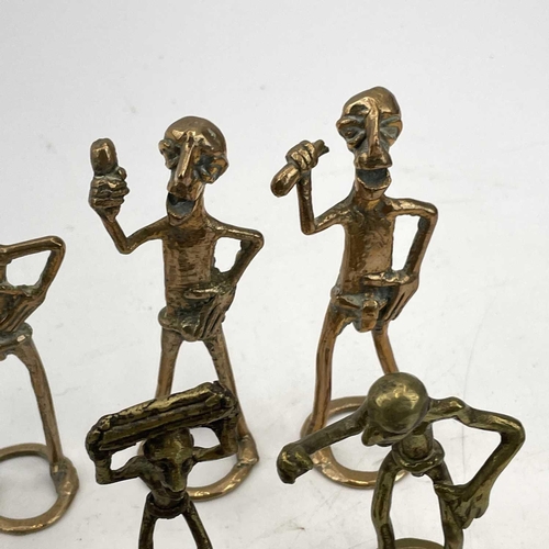 272 - An Ashanti bronze group of three figures drinking from horns on a log, length 16cm together with oth... 