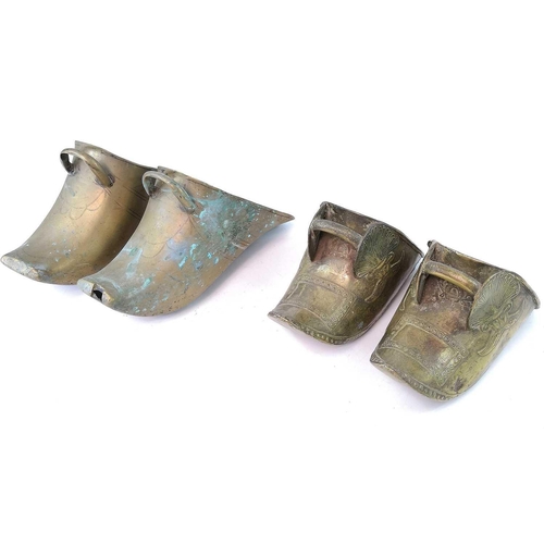 279 - A pair of South American brass stirrups, length 23cm together another pair of brass stirrups, a bras... 